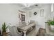 Bright dining room with coffered ceiling, stylish decor, and hardwood floors at 10422 Fenceline Rd, New Port Richey, FL 34655