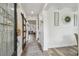 Inviting foyer with decorative glass door, wood accents, and stylish decor sets a welcoming tone at 10422 Fenceline Rd, New Port Richey, FL 34655