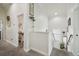 Hallway with white trim and decor leading to a bedroom and other rooms at 10422 Fenceline Rd, New Port Richey, FL 34655