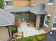 The outdoor space features pavers, ample seating and lovely cafe lighting at 10422 Fenceline Rd, New Port Richey, FL 34655