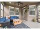 Covered patio with seating, ceiling fan, and natural light at 10422 Fenceline Rd, New Port Richey, FL 34655