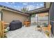 Inviting patio with string lights, grill, bar and comfortable seating for outdoor entertainment at 10422 Fenceline Rd, New Port Richey, FL 34655