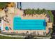 The aerial view showcases the rectangular pool and sunbathing areas at 10422 Fenceline Rd, New Port Richey, FL 34655
