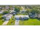 An aerial view showcases the property's layout with a fenced backyard, lush lawns, and nearby community at 11226 Murraysville Dr, Spring Hill, FL 34609
