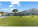 Charming single-story home with a well-manicured front lawn and an attached two-car garage at 11226 Murraysville Dr, Spring Hill, FL 34609