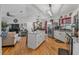 Modern kitchen with island seating, and stainless steel refrigerator is open to dining and living room at 11226 Murraysville Dr, Spring Hill, FL 34609