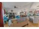 Spacious living room with hardwood floors, seamlessly connected to the kitchen and dining area at 11226 Murraysville Dr, Spring Hill, FL 34609