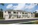Charming townhome featuring a one-car garage, stone accents, and a modern architectural design in a desirable community at 11403 Velvet Apricot Dr, Land O Lakes, FL 34638