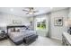 Bedroom featuring a brick accent wall, large window with a view, and modern decor at 11403 Velvet Apricot Dr, Land O Lakes, FL 34638