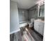 Updated bathroom featuring tiled shower with tub and new white vanity at 1215 Windsor Cir, Brandon, FL 33510