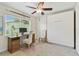 This room has an office setup, a murphy bed, and nice natural light at 1286 Stony Brook Ln, Dunedin, FL 34698