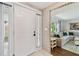 Welcoming entryway with brick accent wall leading to an open living room space at 1286 Stony Brook Ln, Dunedin, FL 34698