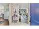 Bright foyer with light brick accent wall leading into an open living space at 1286 Stony Brook Ln, Dunedin, FL 34698