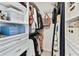 Organized walk-in closet with shelves, drawers, hanging rods, and built-in storage at 1286 Stony Brook Ln, Dunedin, FL 34698