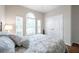 This well-lit bedroom has ample natural light from large windows and includes a double door closet at 1328 Rushgrove Cir, Dover, FL 33527