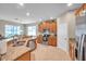 Spacious kitchen with stainless steel appliances, granite countertops, and tile flooring at 1328 Rushgrove Cir, Dover, FL 33527