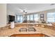 Kitchen island with granite counters overlooks the open-concept living spaces at 1328 Rushgrove Cir, Dover, FL 33527