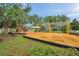 Community playground with swings, slides, and play structures on mulch surface at 1328 Rushgrove Cir, Dover, FL 33527