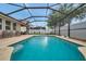 Beautiful screened pool with brick pavers and lounge chairs at 1328 Rushgrove Cir, Dover, FL 33527