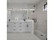 Modern bathroom featuring double vanities, a glass-enclosed shower, and contemporary fixtures for a spa-like experience at 14009 Wenzel Ave, Port Charlotte, FL 33981