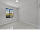 Bedroom with tile flooring and window at 14009 Wenzel Ave, Port Charlotte, FL 33981