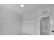 Clean bedroom showcasing tile flooring, neutral color, and closet at 14009 Wenzel Ave, Port Charlotte, FL 33981