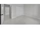 Clean bedroom showcasing tile flooring, neutral color, and closet at 14009 Wenzel Ave, Port Charlotte, FL 33981