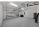Spacious garage with roll up door, epoxy floor, and great ceiling height at 14009 Wenzel Ave, Port Charlotte, FL 33981