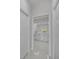 Hallway view of a bathroom with modern vanity, clean lines, and a sleek aesthetic at 14009 Wenzel Ave, Port Charlotte, FL 33981