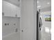 Hallway with laundry and kitchen appliances at 14009 Wenzel Ave, Port Charlotte, FL 33981