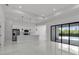 Bright living space featuring an open concept design with modern appliances, an island and access to an outdoor pool at 14009 Wenzel Ave, Port Charlotte, FL 33981