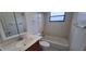 Standard bathroom featuring a vanity with cabinet, toilet, and shower-tub combo at 1401 43Rd S St, St Petersburg, FL 33711