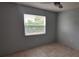 Bedroom with neutral paint, ceiling fan and tile flooring, providing a serene and comfortable living space at 1401 43Rd S St, St Petersburg, FL 33711