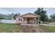 Charming single-story home with a covered carport and well-kept lawn at 1401 43Rd S St, St Petersburg, FL 33711