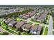 Expansive aerial view of a residential neighborhood featuring well-maintained homes and green spaces at 14110 Barrington Stowers Dr, Lithia, FL 33547
