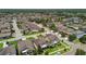 Extensive aerial perspective of a residential area with diverse home styles and mature landscaping at 14110 Barrington Stowers Dr, Lithia, FL 33547