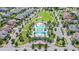 Aerial view of the community pool, park, and surrounding neighborhood in a well-maintained planned community at 14110 Barrington Stowers Dr, Lithia, FL 33547