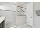 Modern shower featuring frameless shower, white tile and glass, plus a shower niche at 14110 Barrington Stowers Dr, Lithia, FL 33547
