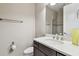 Stylish bathroom with modern vanity, white countertop, and brushed nickel fixtures at 14110 Barrington Stowers Dr, Lithia, FL 33547