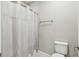 Bathroom featuring a shower with curtain, and a toilet at 14110 Barrington Stowers Dr, Lithia, FL 33547