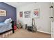 Bedroom with carpeted floors, posters, and wall art, along with a twin bed and closet at 14110 Barrington Stowers Dr, Lithia, FL 33547