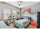 Bedroom featuring neutral walls, a bed, a window, and a ceiling fan at 14110 Barrington Stowers Dr, Lithia, FL 33547