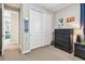 Bedroom with a carpeted floor, skateboard, closet, dresser, night stand, and wall art at 14110 Barrington Stowers Dr, Lithia, FL 33547