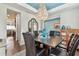 Stylish dining area with a chandelier, comfortable seating, and a view into the rest of the home at 14110 Barrington Stowers Dr, Lithia, FL 33547