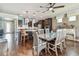 Spacious dining room featuring elegant chandeliers and views of the modern kitchen at 14110 Barrington Stowers Dr, Lithia, FL 33547