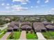 View of single-Gathering homes with manicured lawns and two-car garages in a suburban neighborhood at 14110 Barrington Stowers Dr, Lithia, FL 33547