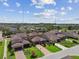 Residential street featuring houses with driveways and well-kept lawns at 14110 Barrington Stowers Dr, Lithia, FL 33547