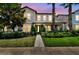 Beautiful two-story home featuring well-manicured landscaping, neutral colors, and a charming front porch at 14110 Barrington Stowers Dr, Lithia, FL 33547