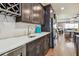 Open kitchen layout with wine rack, stainless steel appliances, and quartz countertops at 14110 Barrington Stowers Dr, Lithia, FL 33547