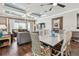 Open-concept living room with view to the dining room and hardwood floors at 14110 Barrington Stowers Dr, Lithia, FL 33547
